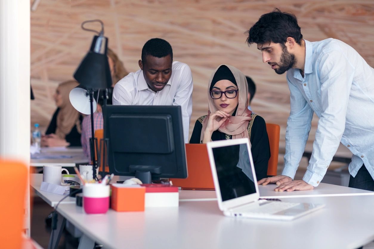 Business owners reviewing performance figures with a consultant